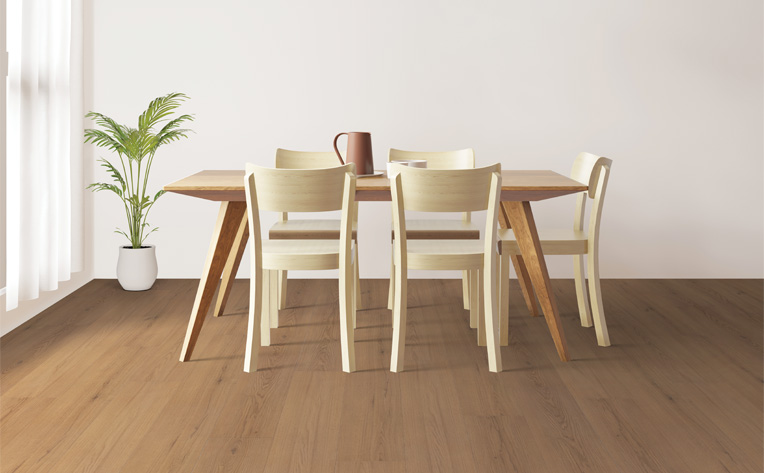 luxury vinyl plank flooring in dining room with wood dining set and plant.